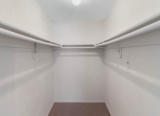 Large closet with bars and shelves