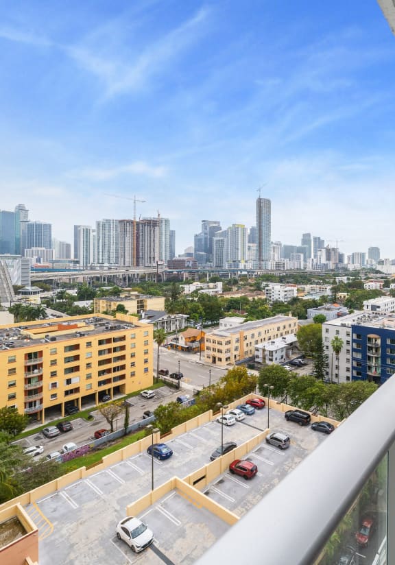 a view of the city from a balcony with a balcony railing