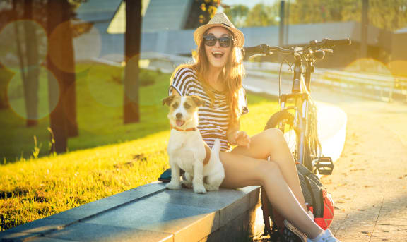 Girl With A Dog And A Bike at Brownstone Apartments, Las Vegas, 89131