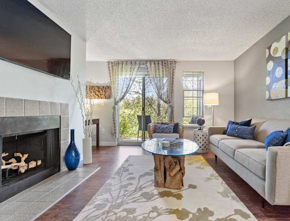 A living room with a fireplace and a couch.