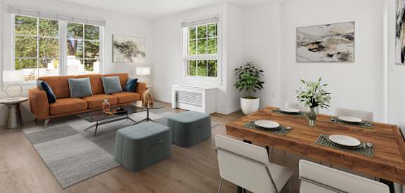 a living room with a couch and a table and chairs
