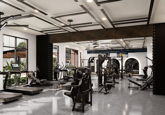 A gym with a variety of equipment including treadmills, weights, and exercise machines.at Parkway Crossings, Florida