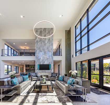 a living room filled with furniture and a large window