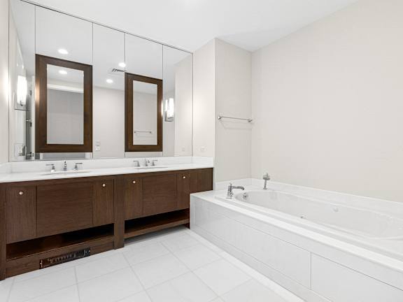 a large white bathroom with a tub and two sinks at HIGHGROVE, Stamford, Connecticut