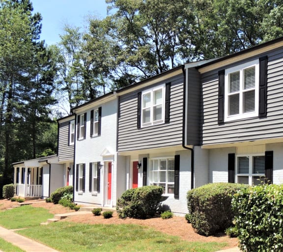 a white house with black siding and a lawn at Greenwood Village, Charlotte, NC, 28273