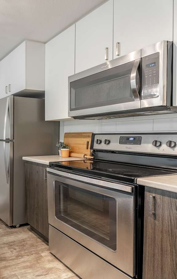 A modern kitchen with a view of the city.