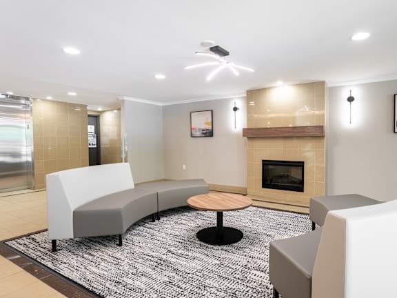 a bedroom with hardwood floors and a large window at Platts Crossing, London, ON