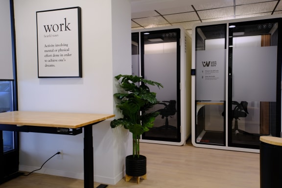 a large glass door with a white sign on the side of it