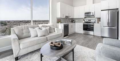A modern kitchen with a view of the city.