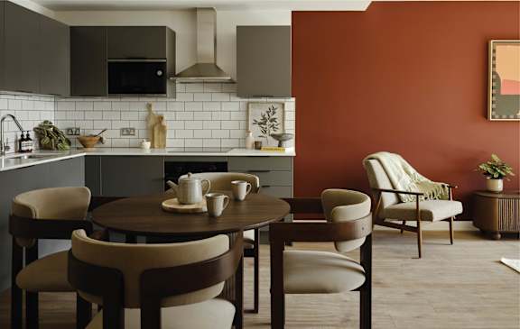 a kitchen with navy blue cabinets and a white counter top