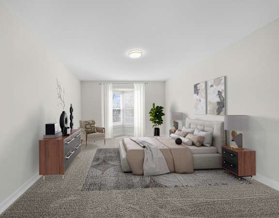 A bedroom with a bed, nightstand, and a plant.