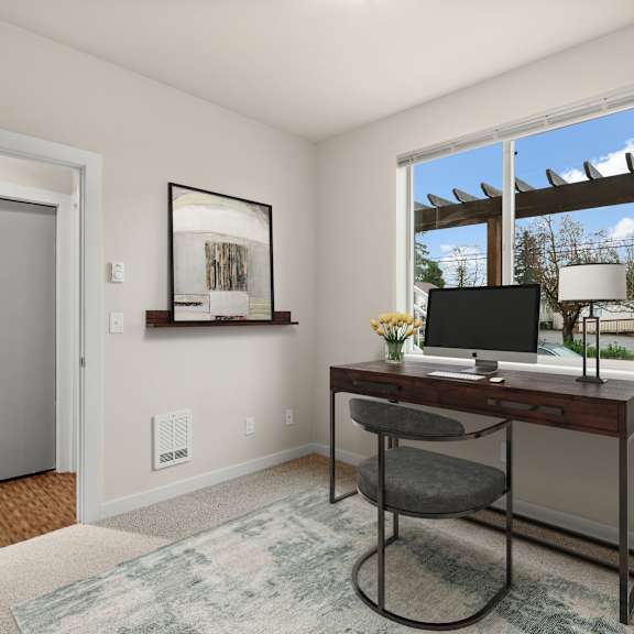 A room with a desk and a chair.