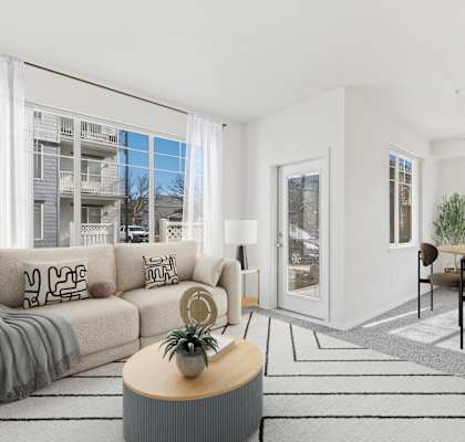 A living room with a grey sofa and a coffee table.