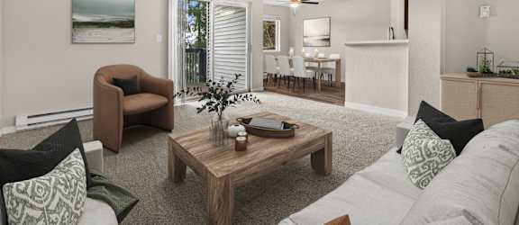 A living room with a brown chair, a coffee table, and a painting on the wall.