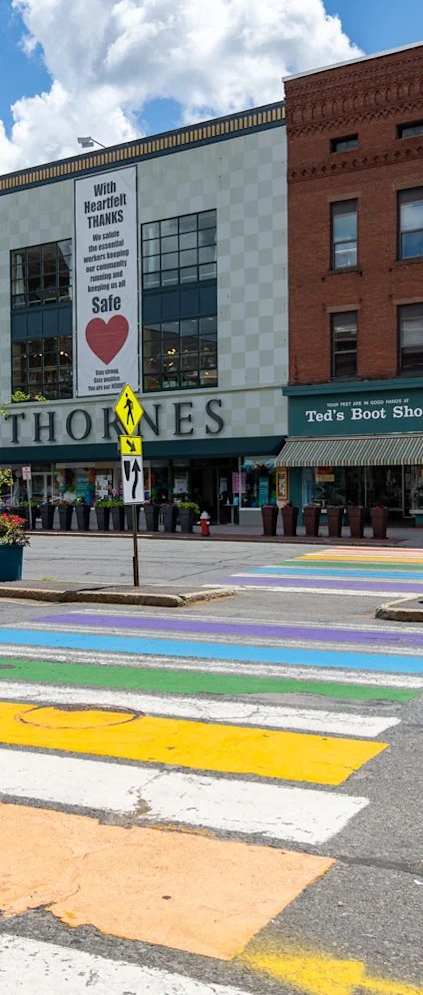 A crosswalk with a rainbow of colors.