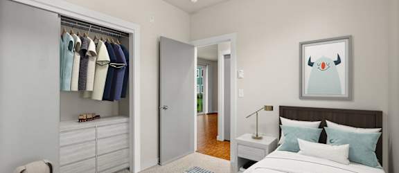 A bedroom with a bed, a wardrobe, and a painting of a penguin on the wall.