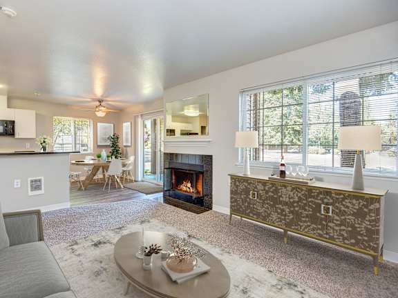A living room with a grey couch and a coffee table.