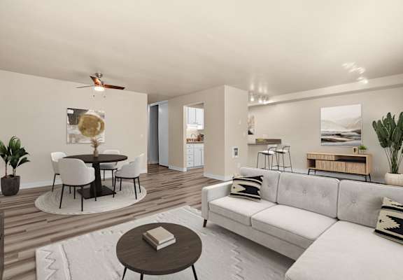A modern living room with a white couch and a round table.