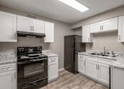Thumbnail 5 of 25 - White Kitchen Cabinets at Lifestyle at Shreveport Apartments, Shreveport, LA, 71109