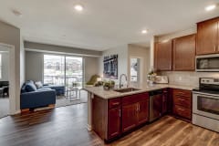 Luxury apartment with dark cabinetry and granite countertops at Ascend at Woodbury MN 55129 new luxury apartments