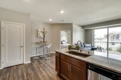 Cherry design scheme with darker cabinetry at Ascend at Woodbury new luxury apartments in Woodbury MN 55129