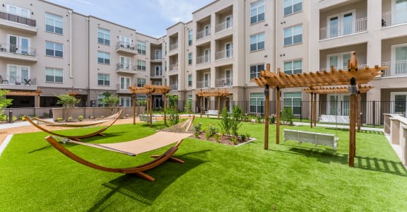 Courtyard with hammocks at Residences at 3000 Bardin Road, Grand Prairie, TX, 75052
