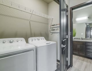Laundry area and spacious bathroom at WH Flats new luxury apartments in south Lincoln NE 68516