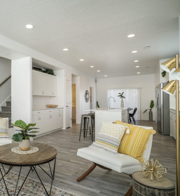 Riverwalk Townhomes Model Living Room and Kitchen with Staircase