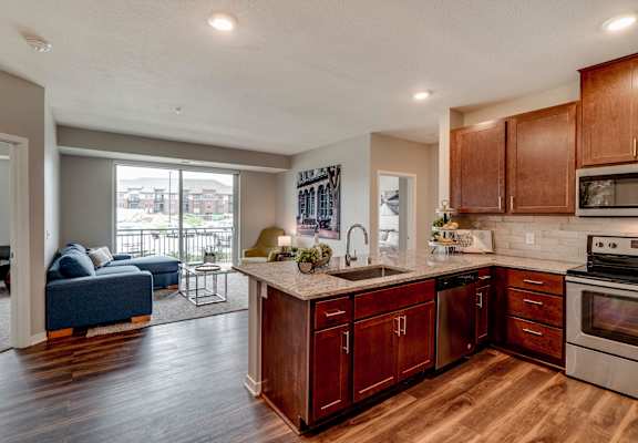 Luxury apartment with dark cabinetry and granite countertops at Ascend at Woodbury MN 55129 new luxury apartments