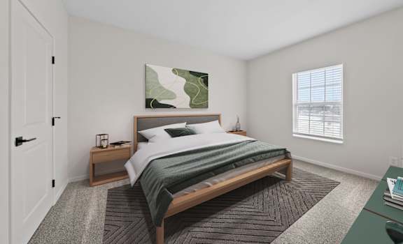 A bedroom with a large bed and a painting on the wall.