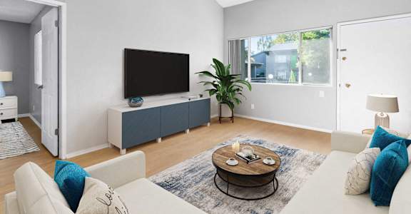 a living room with a couch and a tv