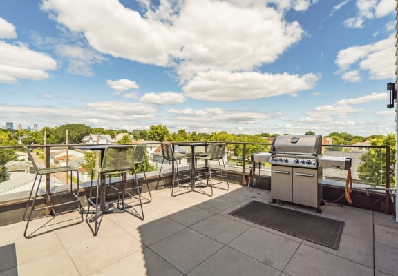 Rooftop patio and outdoor firepit at The Central apartments near downtown Minneapolis MN 55408