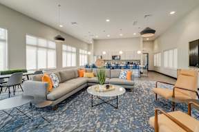 A modern living room with a grey sofa and a coffee table.