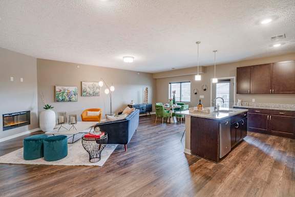 Open floor plan with modern fireplace at The Flats at Shadow Creek new luxury apartments in east Lincoln NE 68520