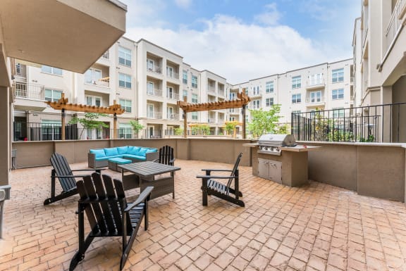 Spacious Patio With Sitting Arrangements with BBQ at Residences at 3000 Bardin Road, Grand Prairie, TX, 75052