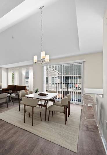 a dining room with a table and chairs at Summit Creek, Canton, MI