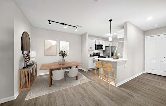 a kitchen with white cabinets and appliances and a sink at Summit Creek, MI 48188