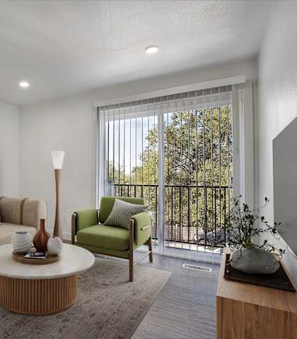 A living room with a couch, a chair, a table, and a lamp.