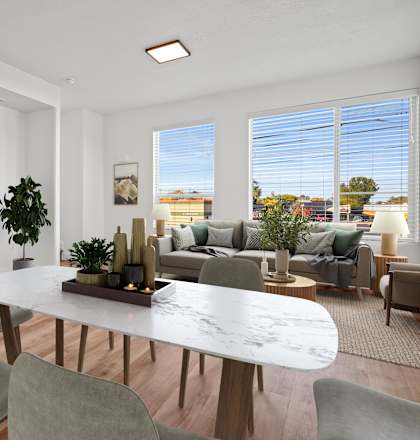 an open living room and dining room with a table and chairs