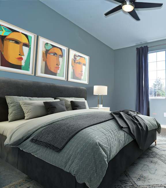 a bedroom with a bed and blue walls at Milan Apartment Townhomes, Las Vegas, NV, 89183