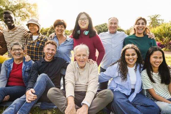a group of people sitting in a park