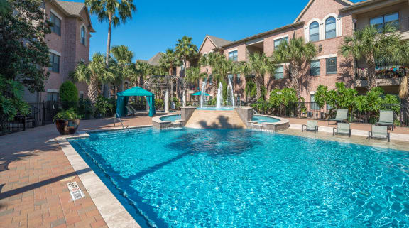 a large swimming pool with a fountains in the Houston Texas Medical Center