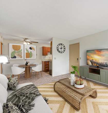 a living room with a couch and a coffee table at The Woodridge Collection, Ohio