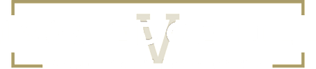A black and gold sign for Vanderbilt Properties.