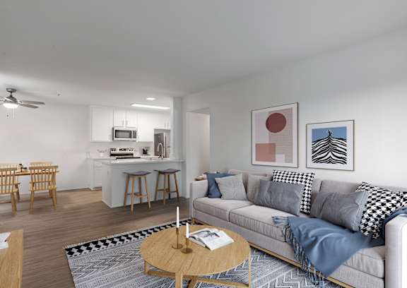 A living room with a grey couch and a coffee table.