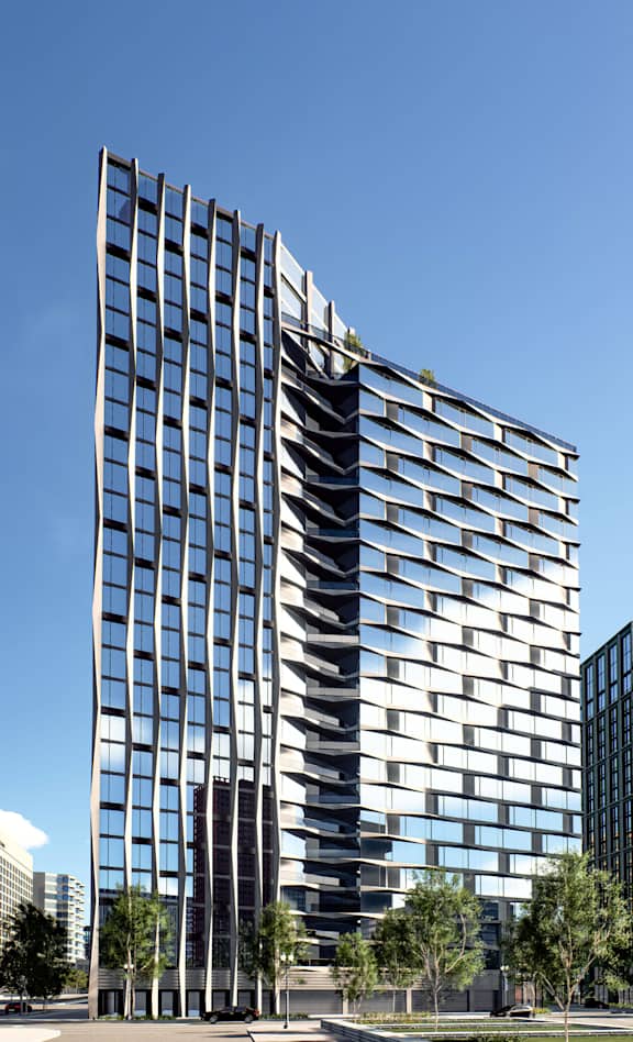 A tall building with a glass facade and a series of horizontal lines.