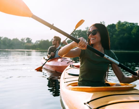 a group of people kayaking on a lake at Rivulet, Silverdale Washington