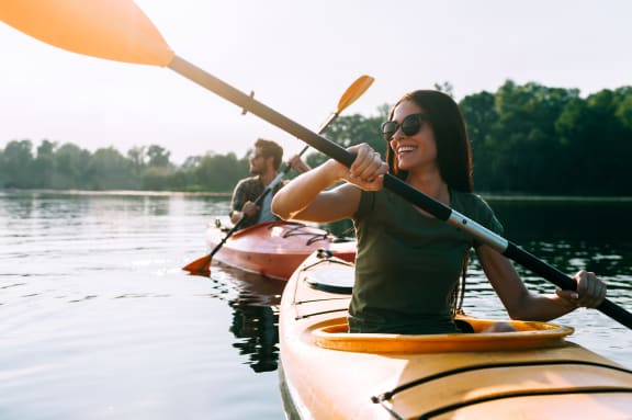 a group of people kayaking on a lake