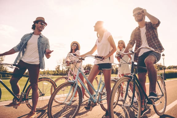 Mandan, ND Diamond Bend Apartments |a group of people riding bikes down a street Mandan, ND Diamond Bend Apartments |a group of people riding bikes down a street