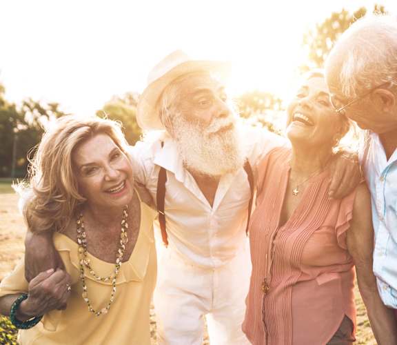 a group of people standing together in the sun